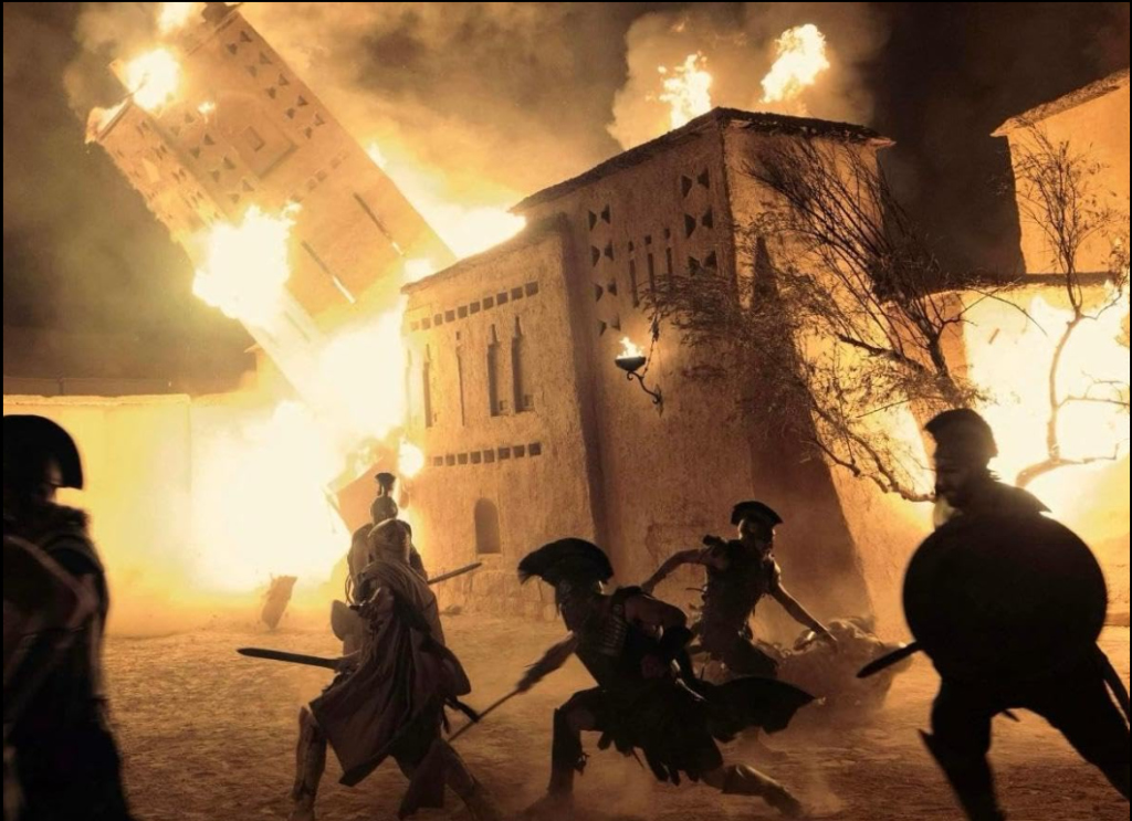 The Odyssey Movie 2026 epic scene showing Odysseus standing near the sea during his journey home